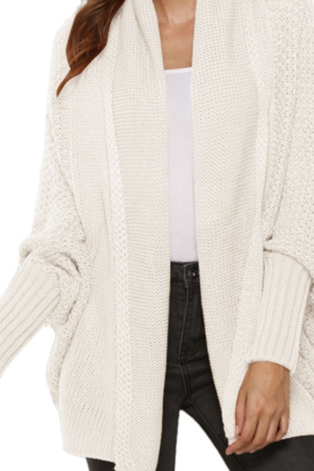 Ivory cocoon knit cardigan with shawl collar and batwing sleeves.