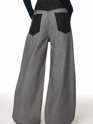 Men's grey wide leg jeans with dark grey back pockets and waistband.
