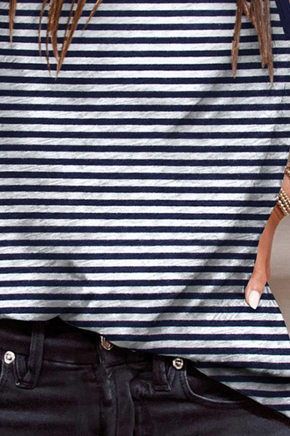 Navy and white striped tank top with contrast trim detail.