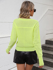 Relaxed fit v-neck knit sweater in yellow-green with long sleeves and ribbed cuffs.