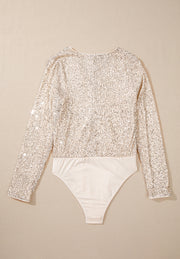 Ivory sequin long sleeve bodysuit with a deep V-neck and a smooth bottom.