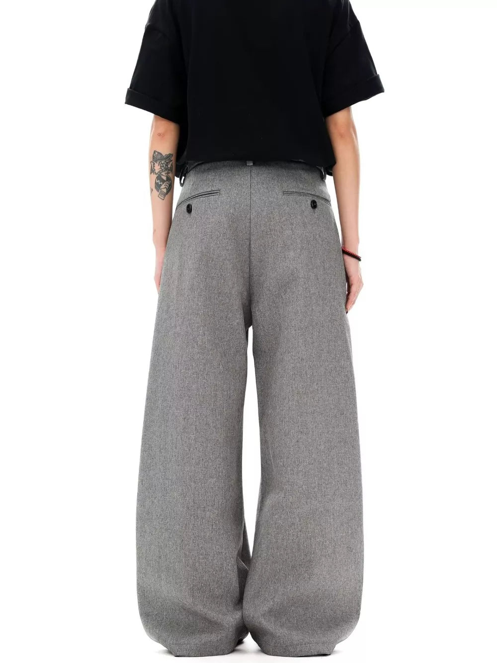 Men's grey wide-leg pleated sweatpants with a relaxed fit and button-tab back pockets.