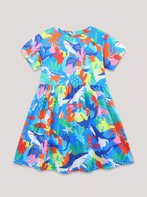Toddler A-line dress with a vibrant ocean print featuring sharks, turtles, and coral.
