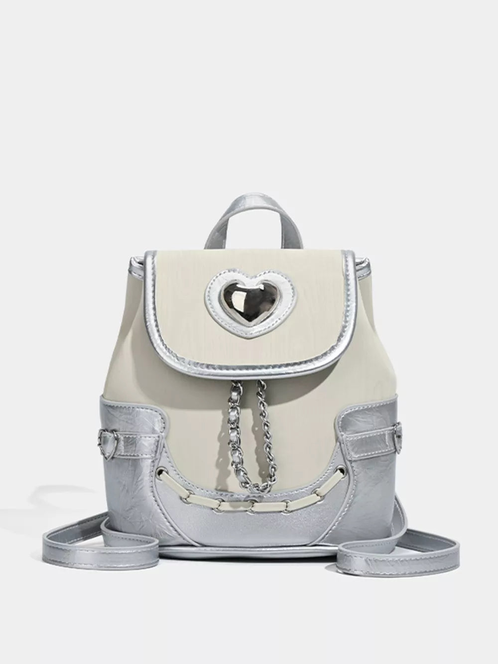 Charming mini heart flap backpack in cream and silver with chain detail.