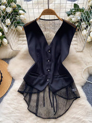 Black button-down vest coat with lace embellishments and a high-low hem.