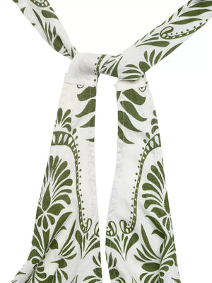 White and green botanical print halter neck jumpsuit with tie detail