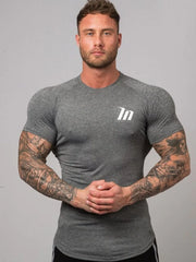 Dark Gray Performance Fit Raglan Tee with white logo and short sleeves.