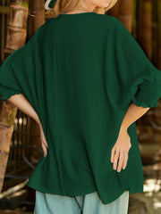 Dark green textured blouse with elastic cuff sleeves and relaxed fit