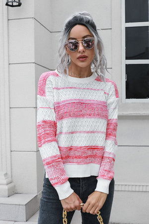 Ombre stripe knit sweater in pink and white with a crew neck and textured pattern.