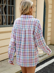Long sleeve collared plaid shirt in pastel purple, blue, and white with button cuffs.