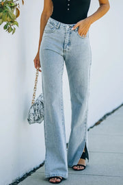 Light wash denim flared hem trousers with side slits