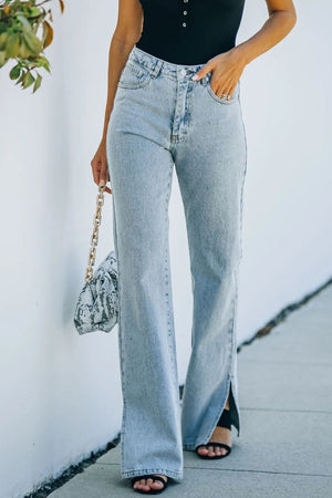 Light wash denim flared hem trousers with side slits