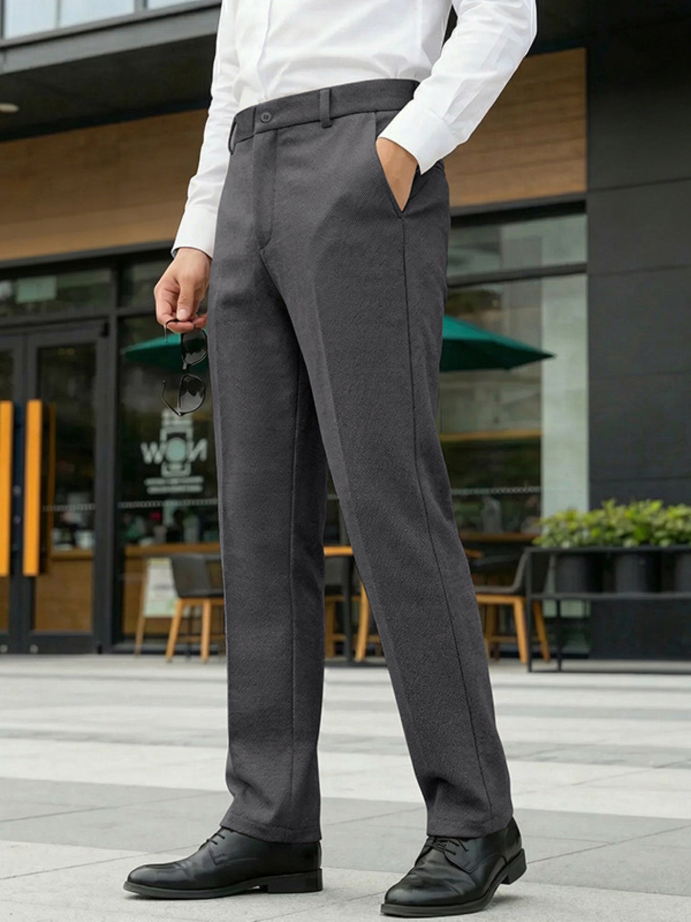 Men's classic fit dress pants in dark gray with pockets and a straight leg cut.