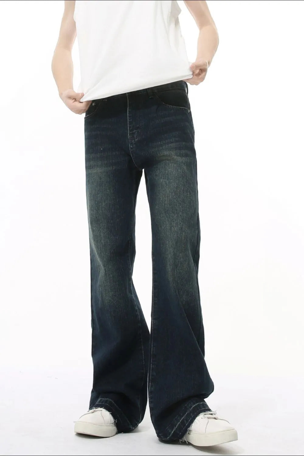 Dark wash flare jeans with vintage fading and a relaxed fit.