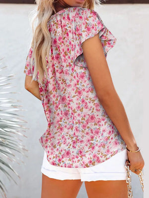 Floral flutter sleeve v-neck blouse in pink and white floral print, polyester.