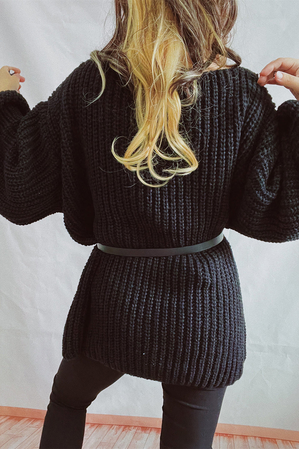 Black oversized ribbed knit mini dress with belt detail