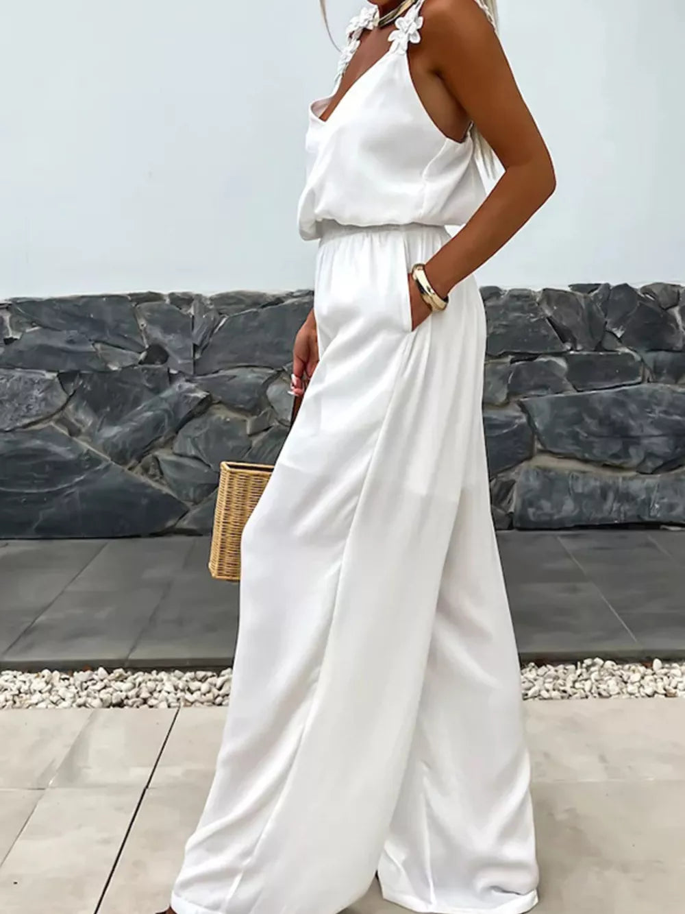 White floral applique wide-leg jumpsuit with blouson waist and V-neck.