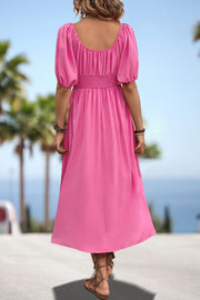 Pink off-shoulder empire midi dress with puff sleeves and smocked waist