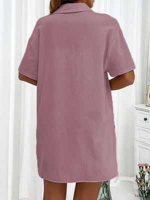 Pink linen shirt and shorts co-ord set with short sleeves and a collar.