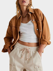 Oversized caramel washed cotton utility jacket with button closure and distressed details.