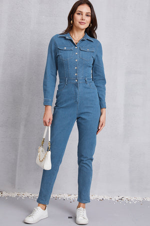 Denim utility jumpsuit in medium wash with defined waist, button front, and chest pockets.