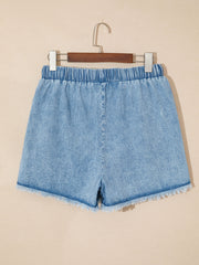 Light wash denim shorts with frayed hem and elastic drawstring waist