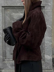 Dark brown suede tie-waist bolero jacket with a wide collar and cinched waist detail.