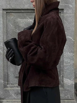 Dark brown suede tie-waist bolero jacket with a wide collar and cinched waist detail.
