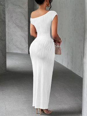 White textured one-shoulder maxi dress with ruched detail and asymmetrical neckline.