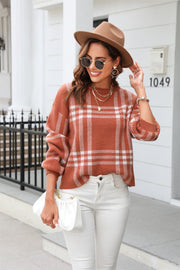Caramel plaid crewneck sweater in acrylic with white plaid pattern.
