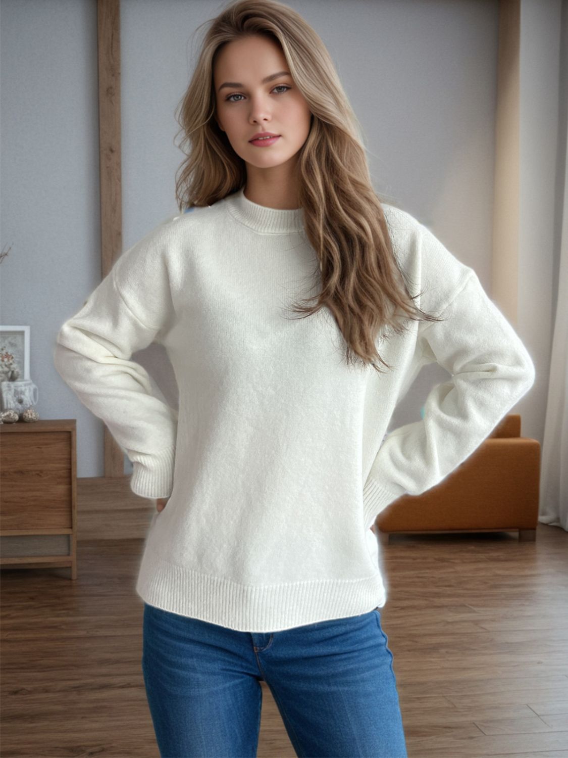 Textured knit crew neck pullover sweater in cream with ribbed cuffs and hem.