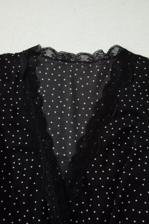 Black polka dot mini dress with lace trim neckline and trim detail