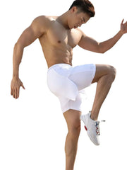 White layered performance training shorts with a drawstring waist and mesh accents.