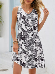 White botanical print mini dress with crochet shoulder detail and V-neck.