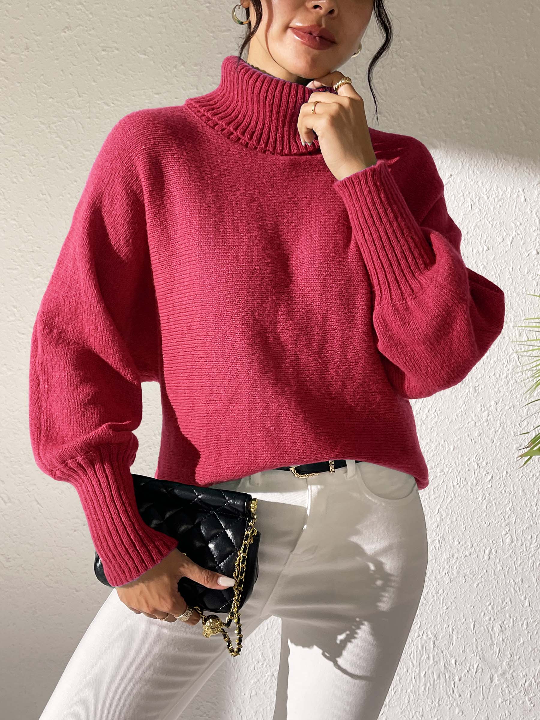 Balloon sleeve turtleneck sweater in deep red with ribbed cuffs and collar.