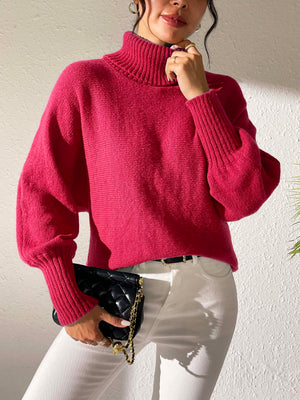 Balloon sleeve turtleneck sweater in deep red with ribbed cuffs and collar.