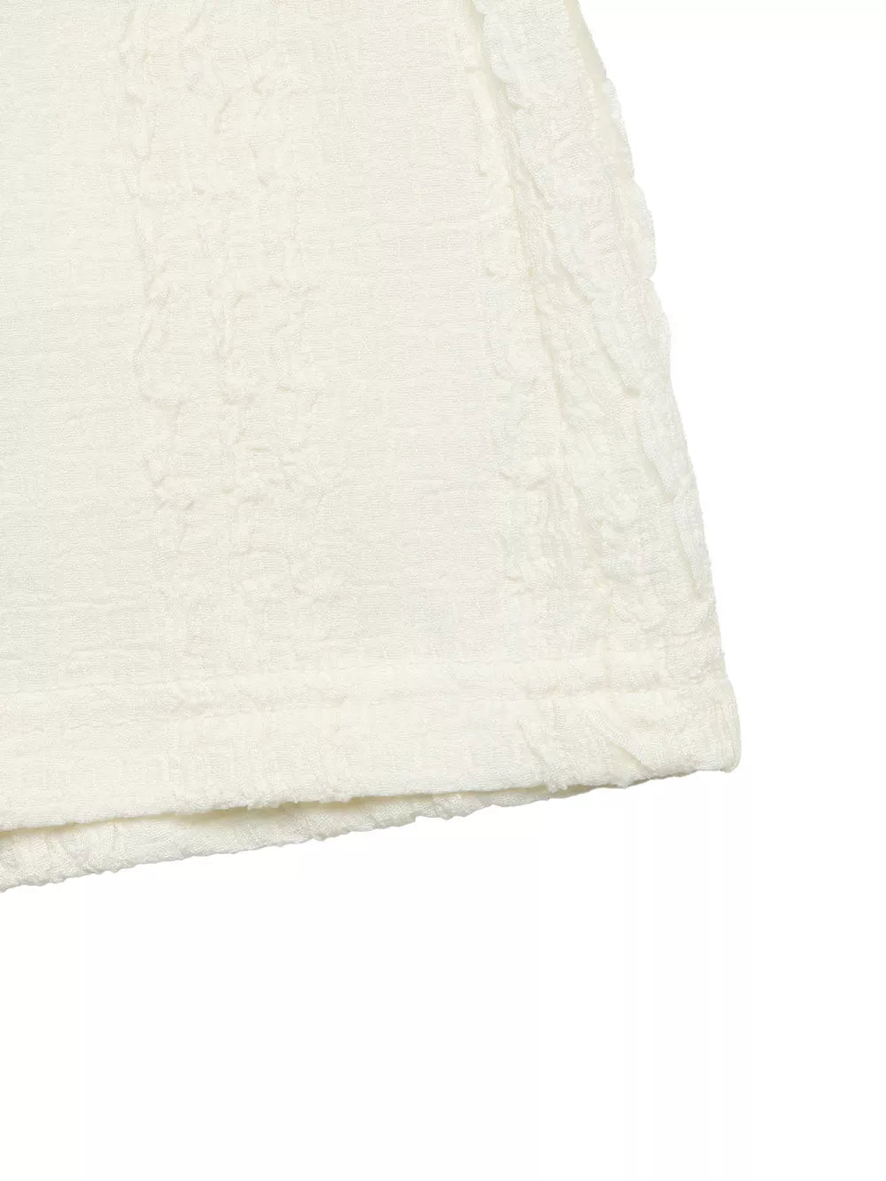 Crinkled texture t-shirt in ivory with ruffled sleeve detail and polyester fabric.