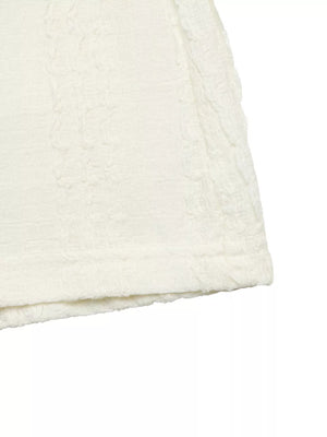 Crinkled texture t-shirt in ivory with ruffled sleeve detail and polyester fabric.