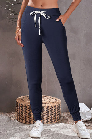 Slim-fit navy lounge joggers with drawstring waist and cuffed ankles