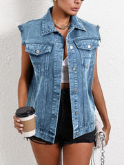 Medium wash denim vest with raw edges, collared neckline, button front, and chest pockets.