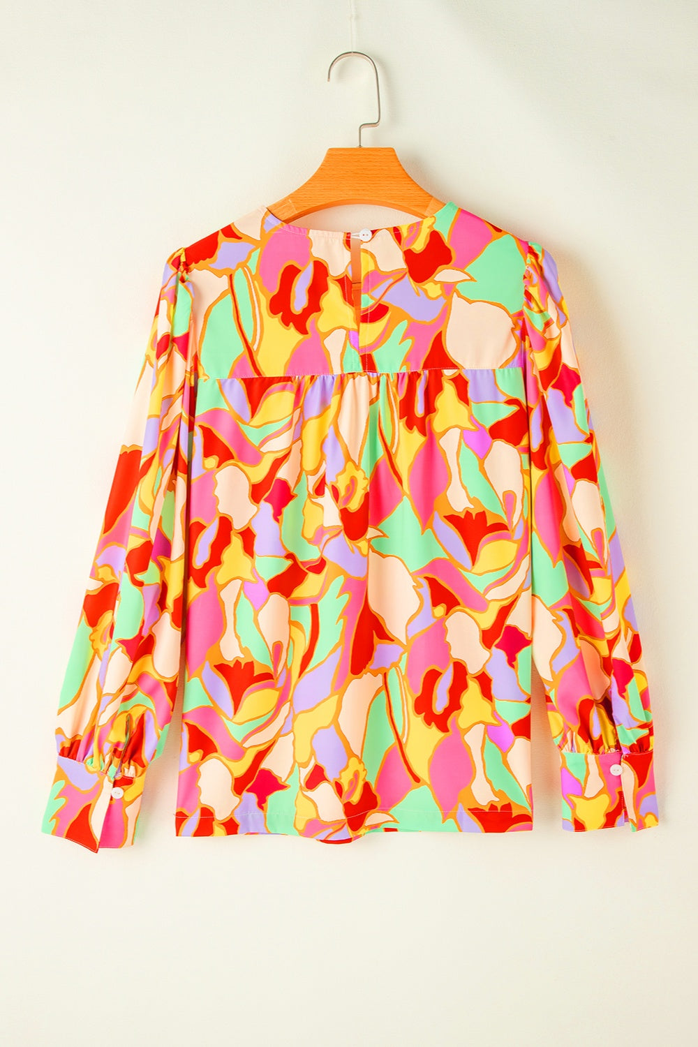 Psychedelic print gathered yoke blouse with long sleeves and button cuffs in floral.