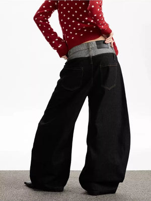 Layered double waist wide leg jeans in dark wash cotton with a relaxed fit.