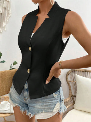 Black button-down vest with sculpted lapels and gold buttons, styled with denim shorts.