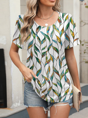Women's white short sleeve blouse with vibrant stained glass floral print.