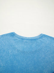 Mineral washed blue cotton crew neck t-shirt with a relaxed fit.