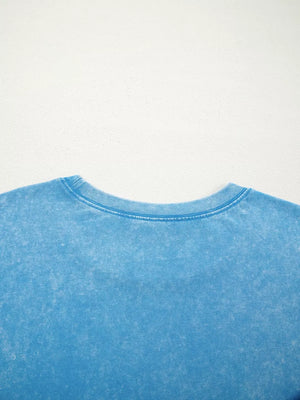 Mineral washed blue cotton crew neck t-shirt with a relaxed fit.