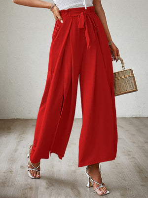 Red paperbag waist palazzo pants with side slits and tie belt