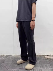 Black men's sweatpants with a drawstring waist and relaxed fit.