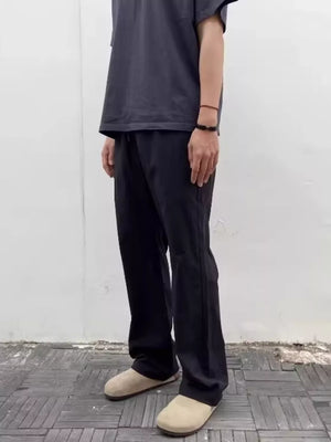 Black men's sweatpants with a drawstring waist and relaxed fit.