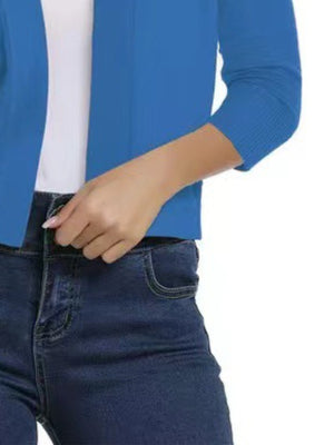 Azure open-front cropped cardigan with elbow sleeves and ribbed cuffs.